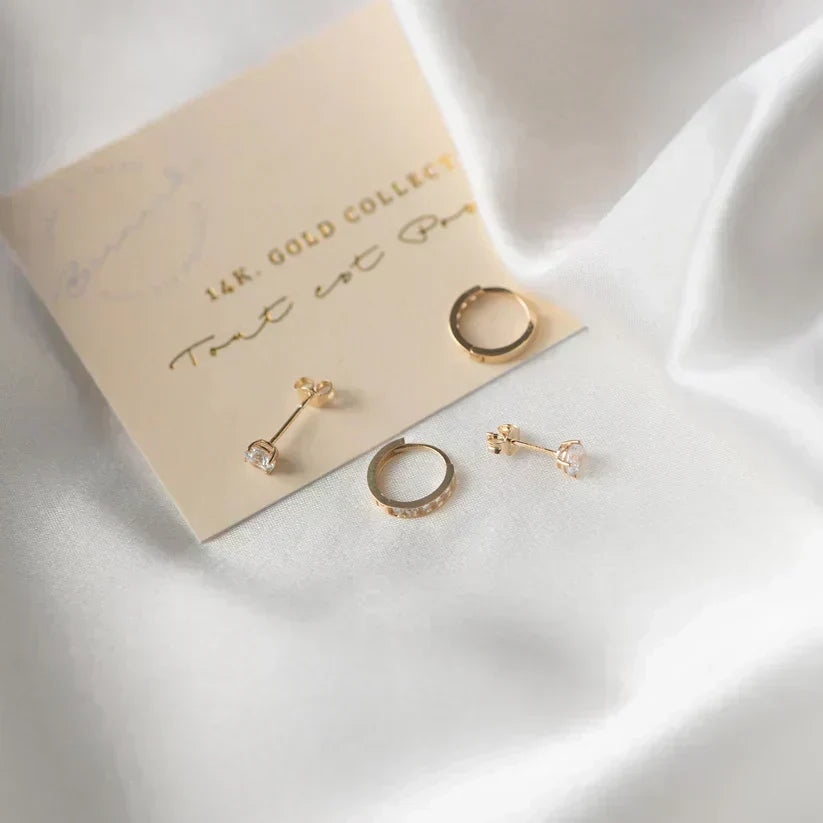 Goldene Ohrringe Larmes™ mit goldenem Stein von Rose & Oliver, zarter und eleganter Stil, Bild von Creolen.